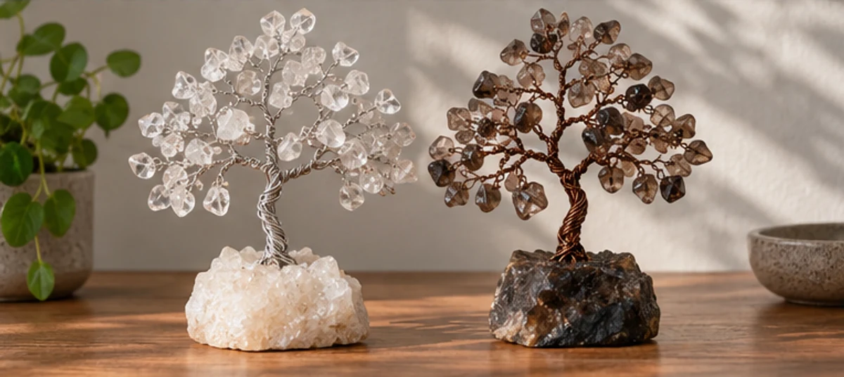 Clear quartz and smoky quartz tree designs on a shelf