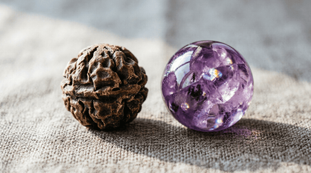 Rudraksha bead and natural gemstone in a calm product-selection composition