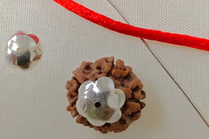 Rudraksha bead detail used for a capping and construction guide